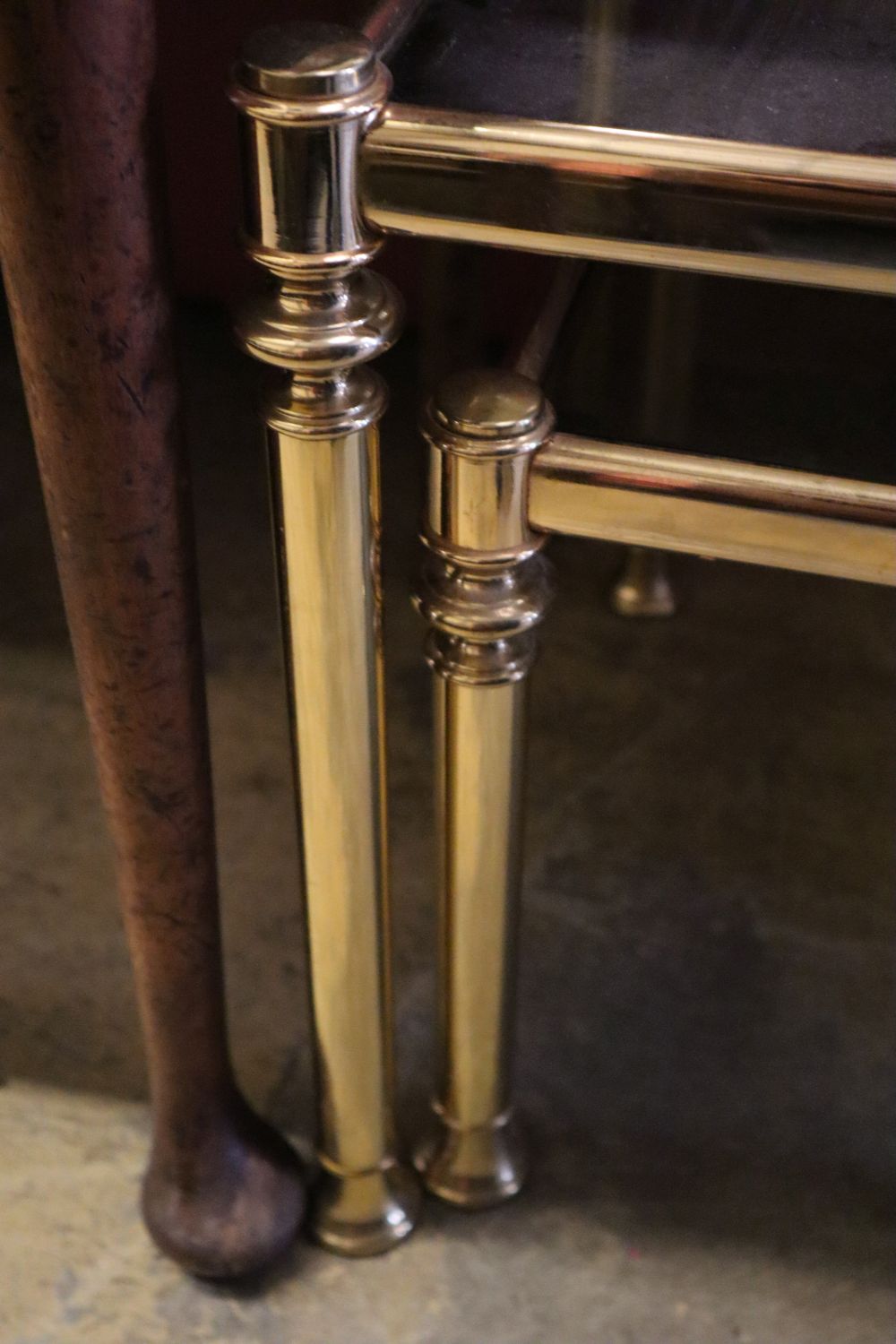 A nest of three brass and smoked glass tea tables, width 90cm depth 50cm height 44cm